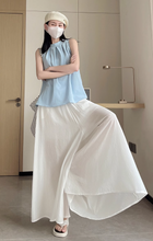 画像をギャラリービューアに読み込む, カフェテラスで見たパリの朝陽に映える優雅なスカート_K0060